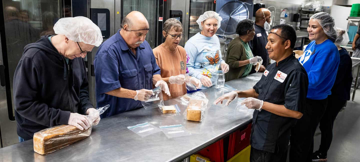 volunteers packing community meals for neighbors